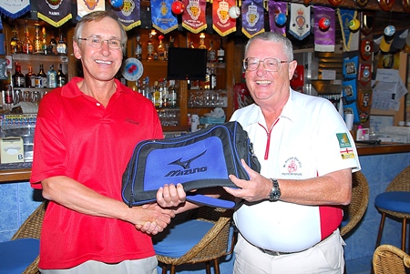 Dick Warberg, right, presents the Golfer of the Month award to Doug Maiko.